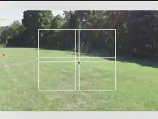 A first person view of a drone intercepting a balloon.